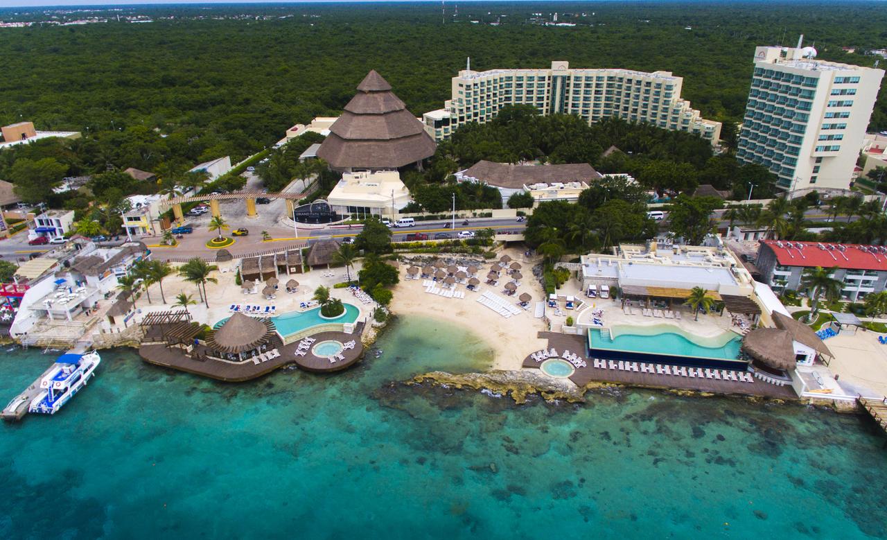 Grand Park Royal Cozumel all-inclusive resort with beachfront pools, lush tropical gardens, and ocean views on Cozumel Island.