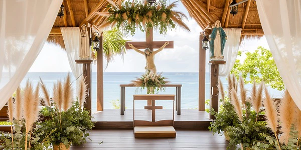 Oceanfront chapel ceremony setup at Dreams Cozumel Cape overlooking the Caribbean Sea