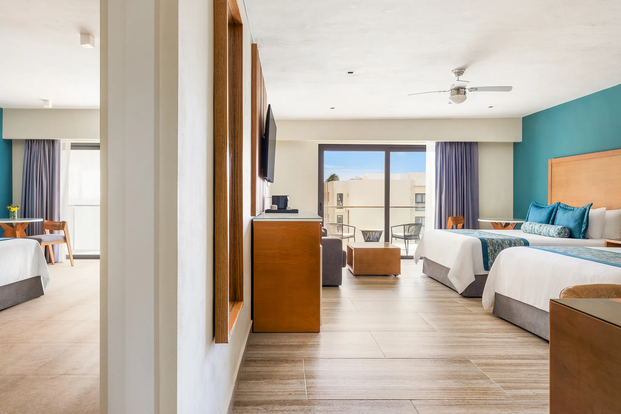 Connecting living area and bedrooms in Preferred Club Family Suite at Dreams Cozumel Cape Resort & Spa.