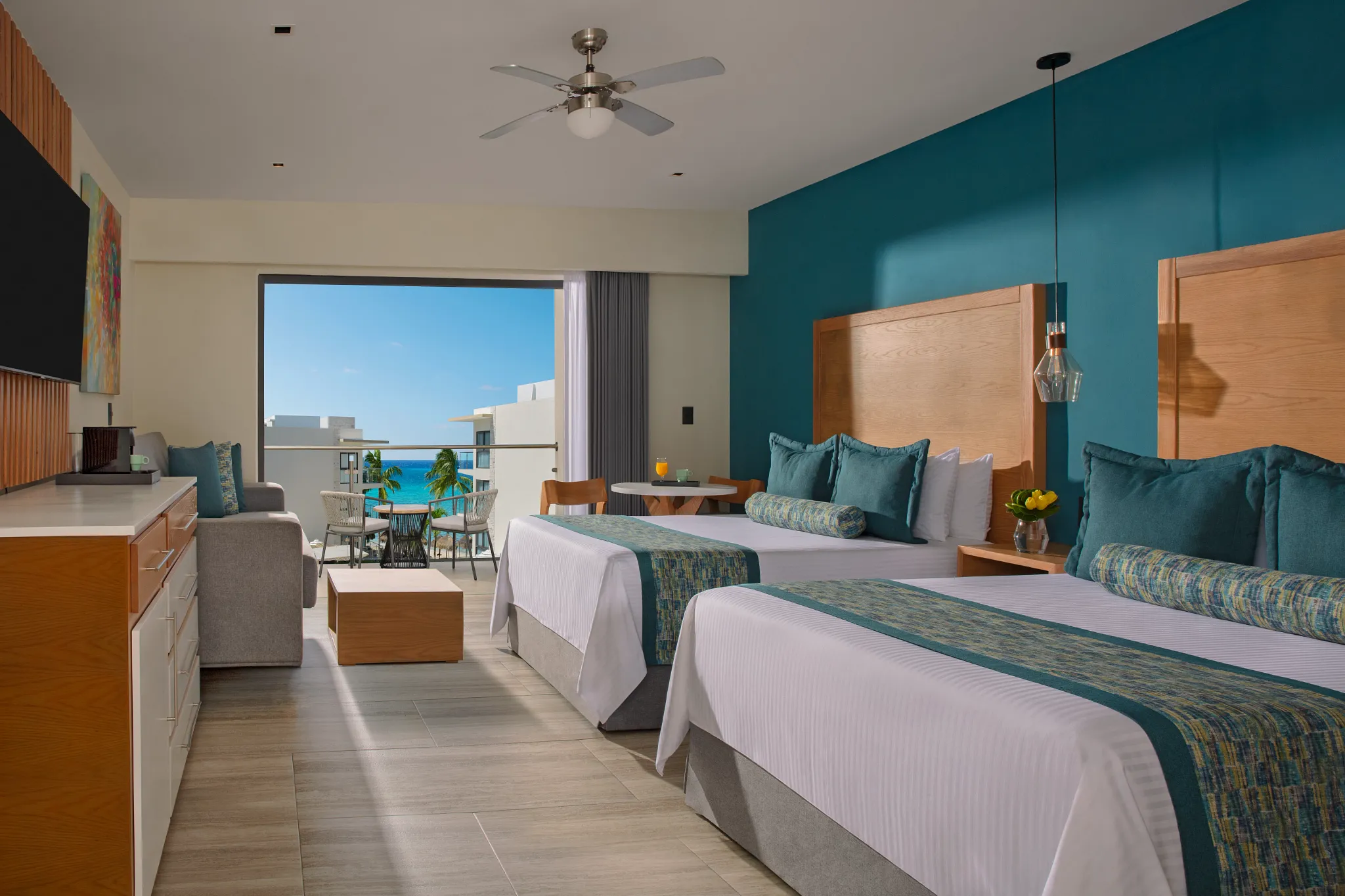 Preferred Club Family Suite with two queen beds and balcony at Dreams Cozumel Cape Resort & Spa.