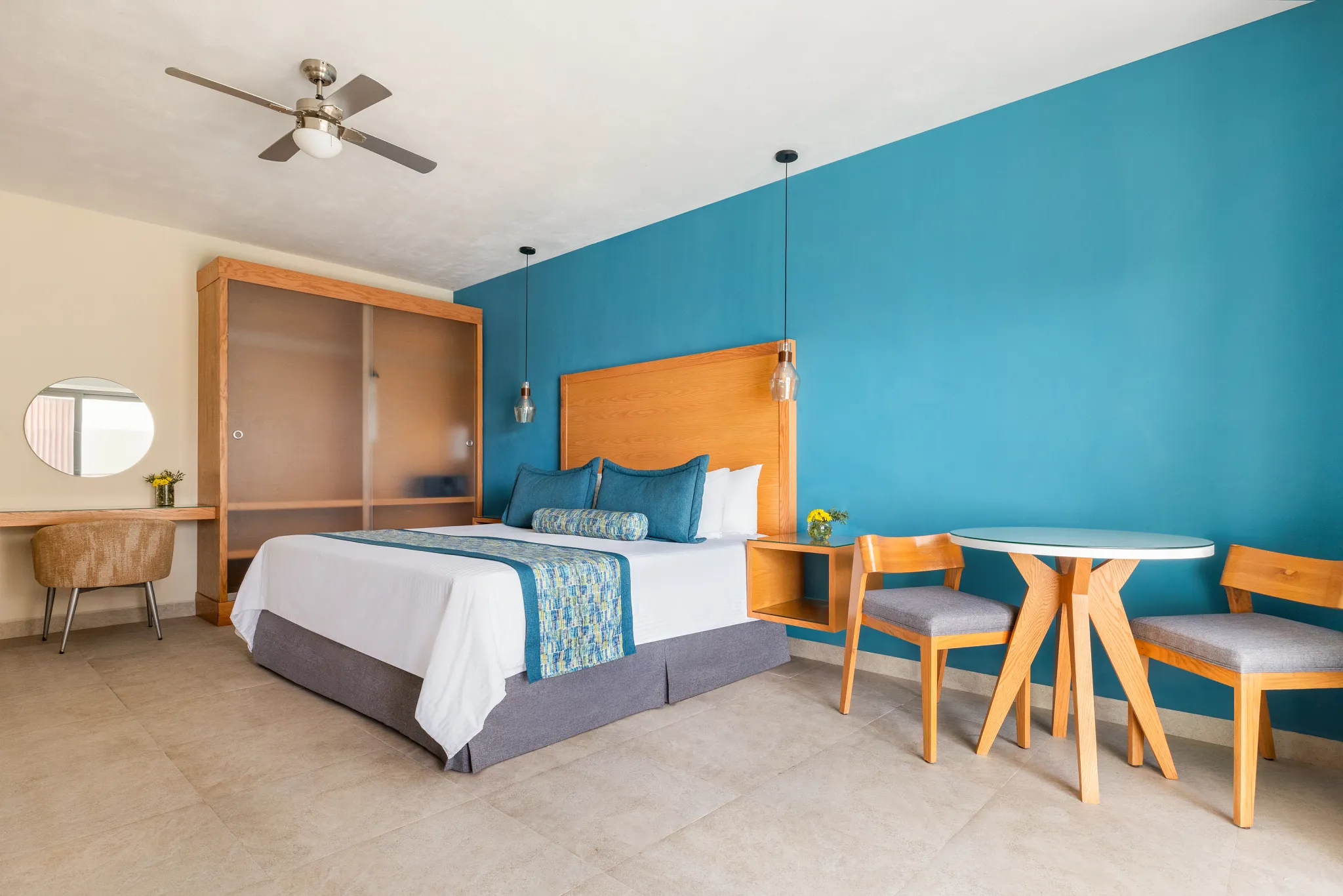 Preferred Club Junior Suite King with modern wood furnishings and resort views at Dreams Cozumel Cape Resort & Spa.