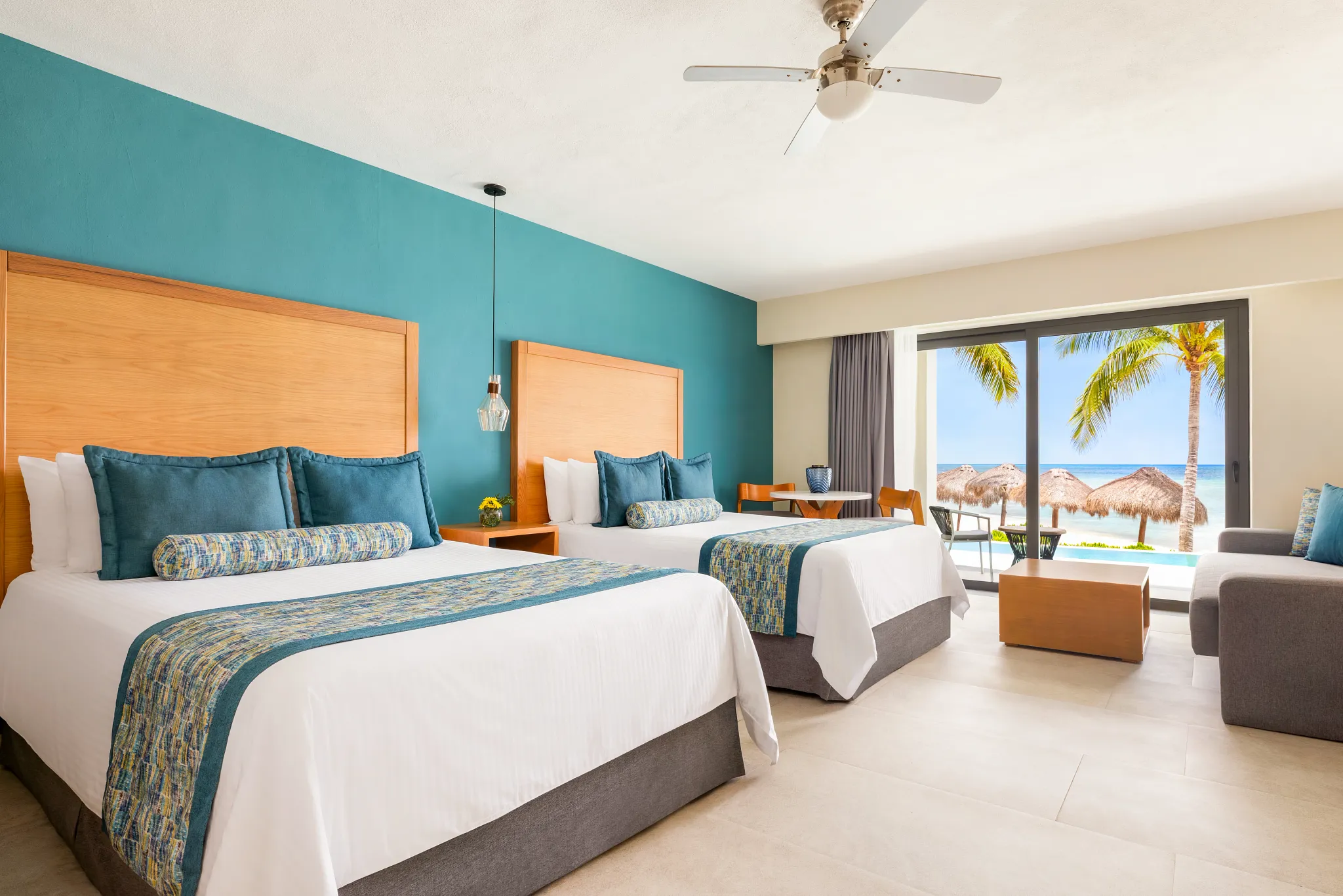 Preferred Club Junior Suite Swim Out Beach Front with two queen beds at Dreams Cozumel Cape Resort & Spa.